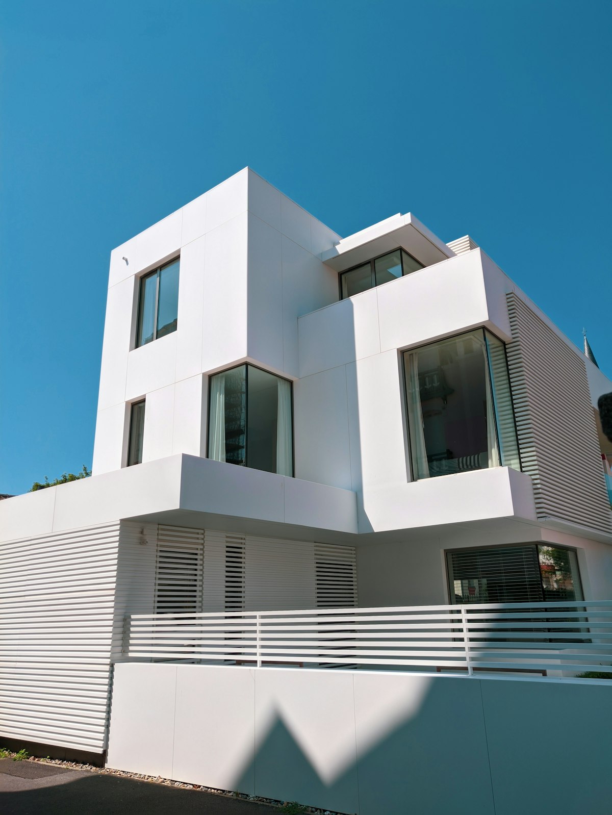White concrete building under blue sky